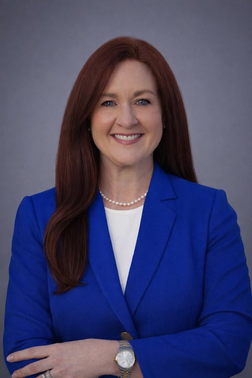 Professional headshot with blue blazer